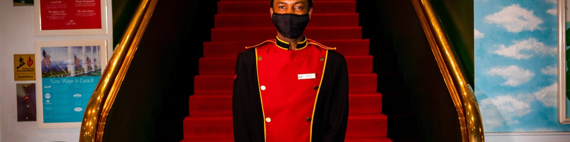 A staff member wearing a mask